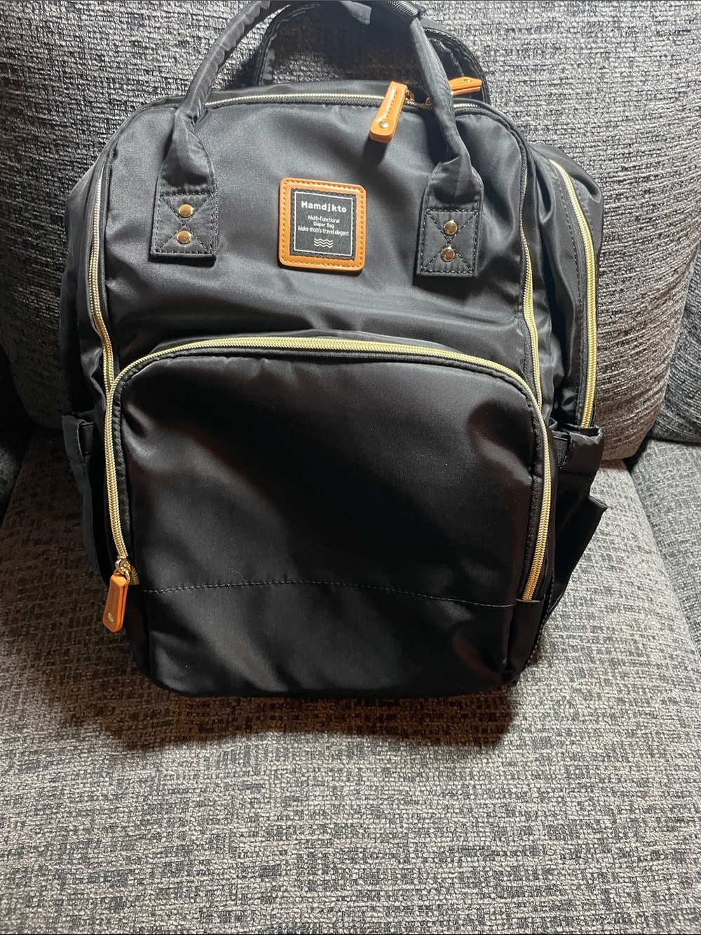 Classic Black Baby Bag Backpack with Tan Accents